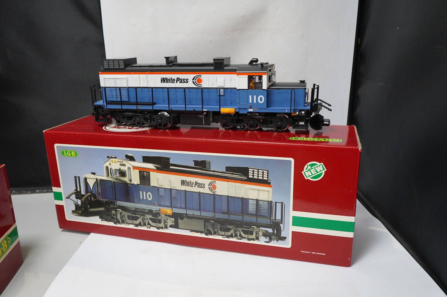 A boxed Lehman LGB (2055) G scale railway White Pass Co-Co diesel locomotive, 110, in blue and white livery. Condition - good, evidence of very minor running wear only.